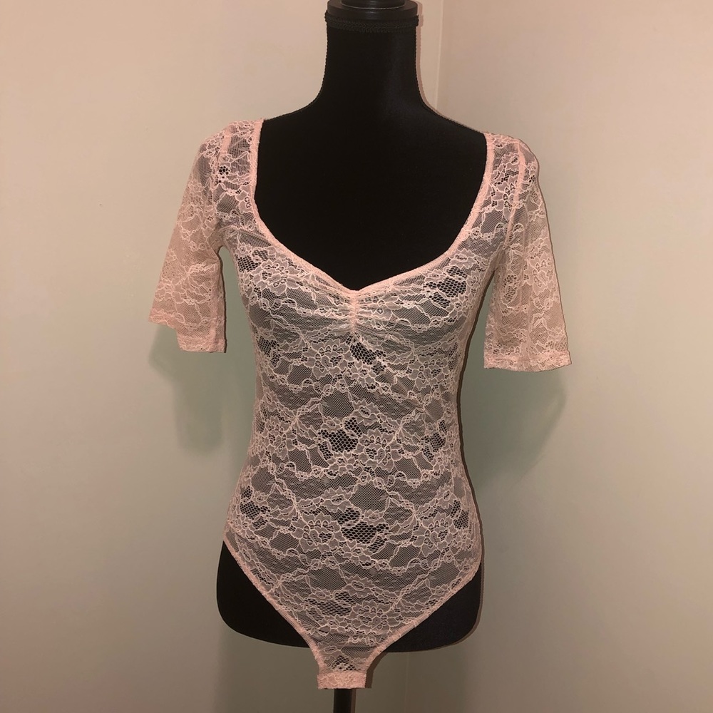 Brand New Zara Trafaluc Beige bodysuit tee.